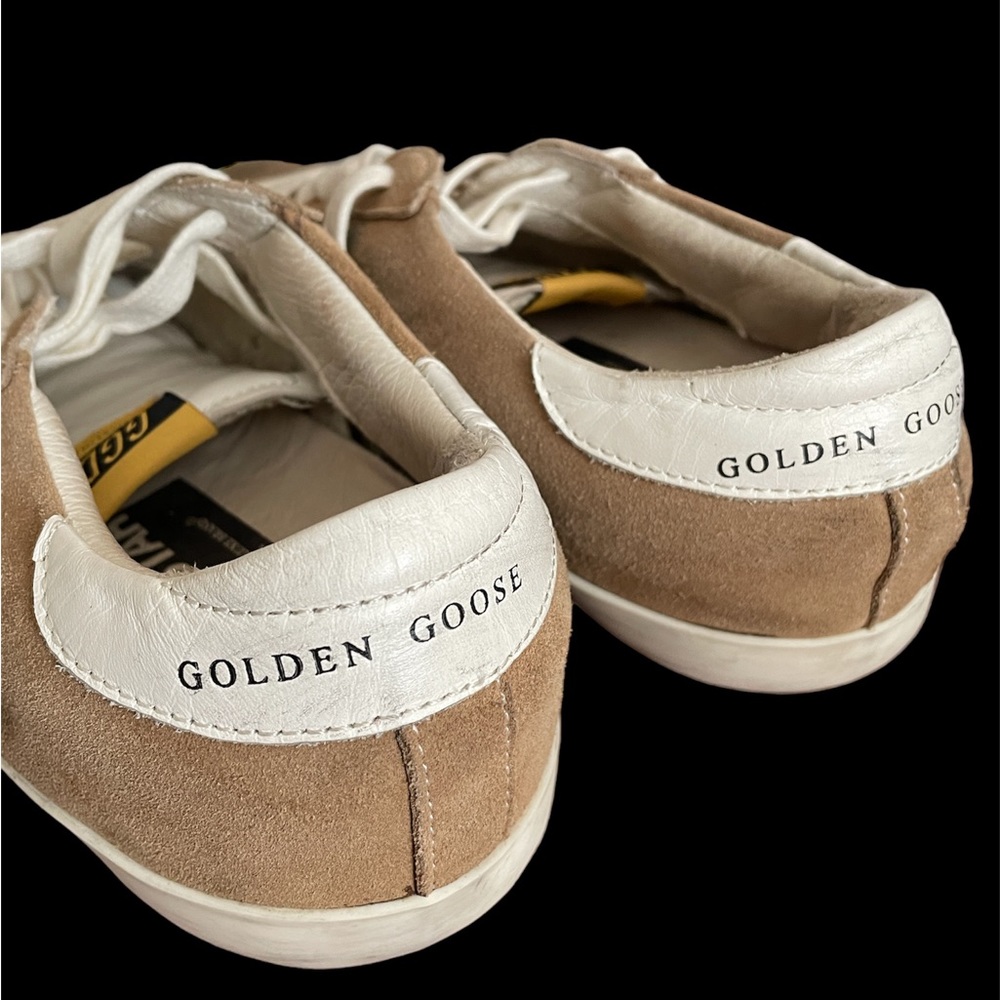 Authentic pair of sneakers by Golden Goose.